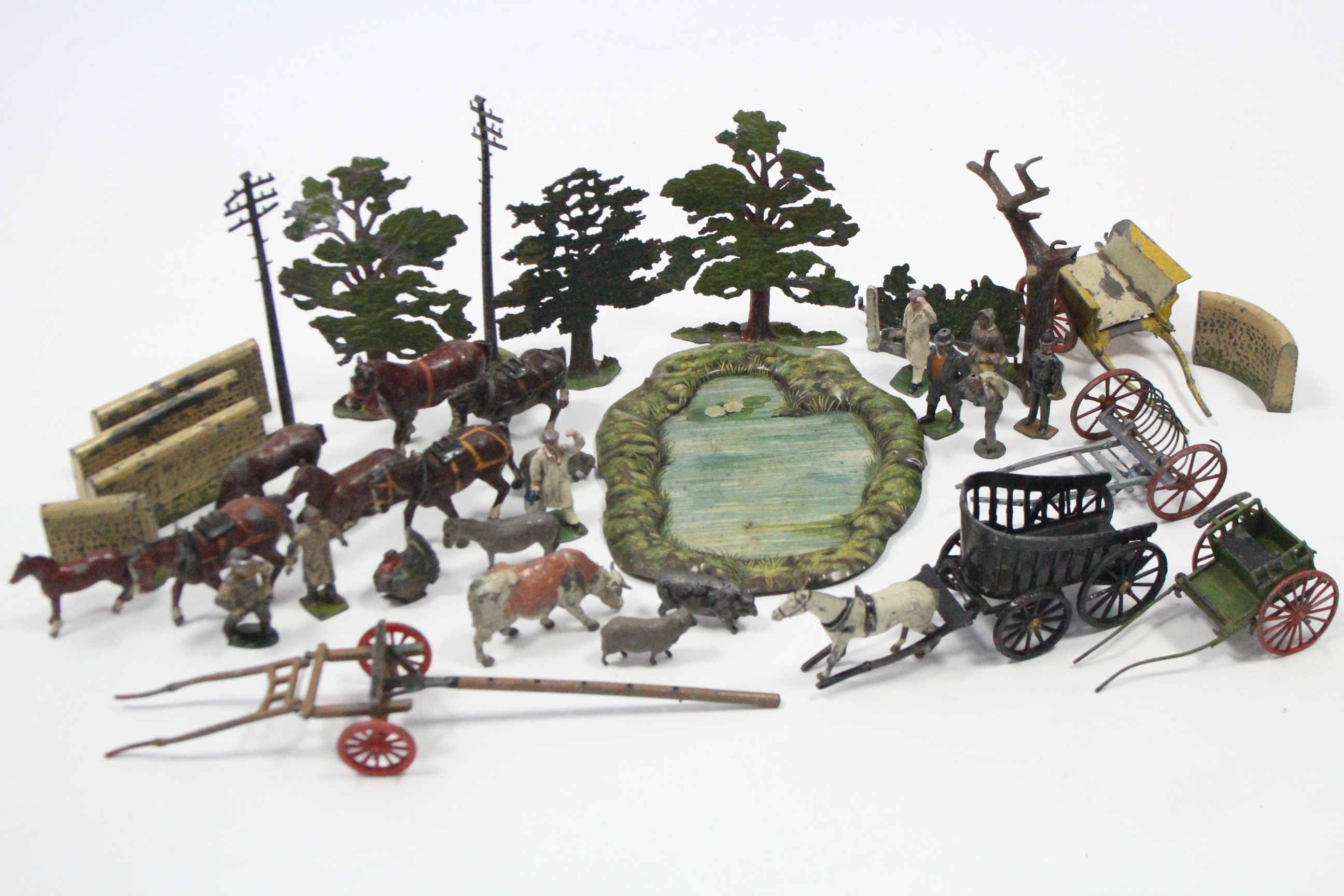 A QUANTITY OF BRITAINS PAINTED LEAD FARM MODELS INCLUDING FARMERS, MACHINER, TREES, ETC., all un-