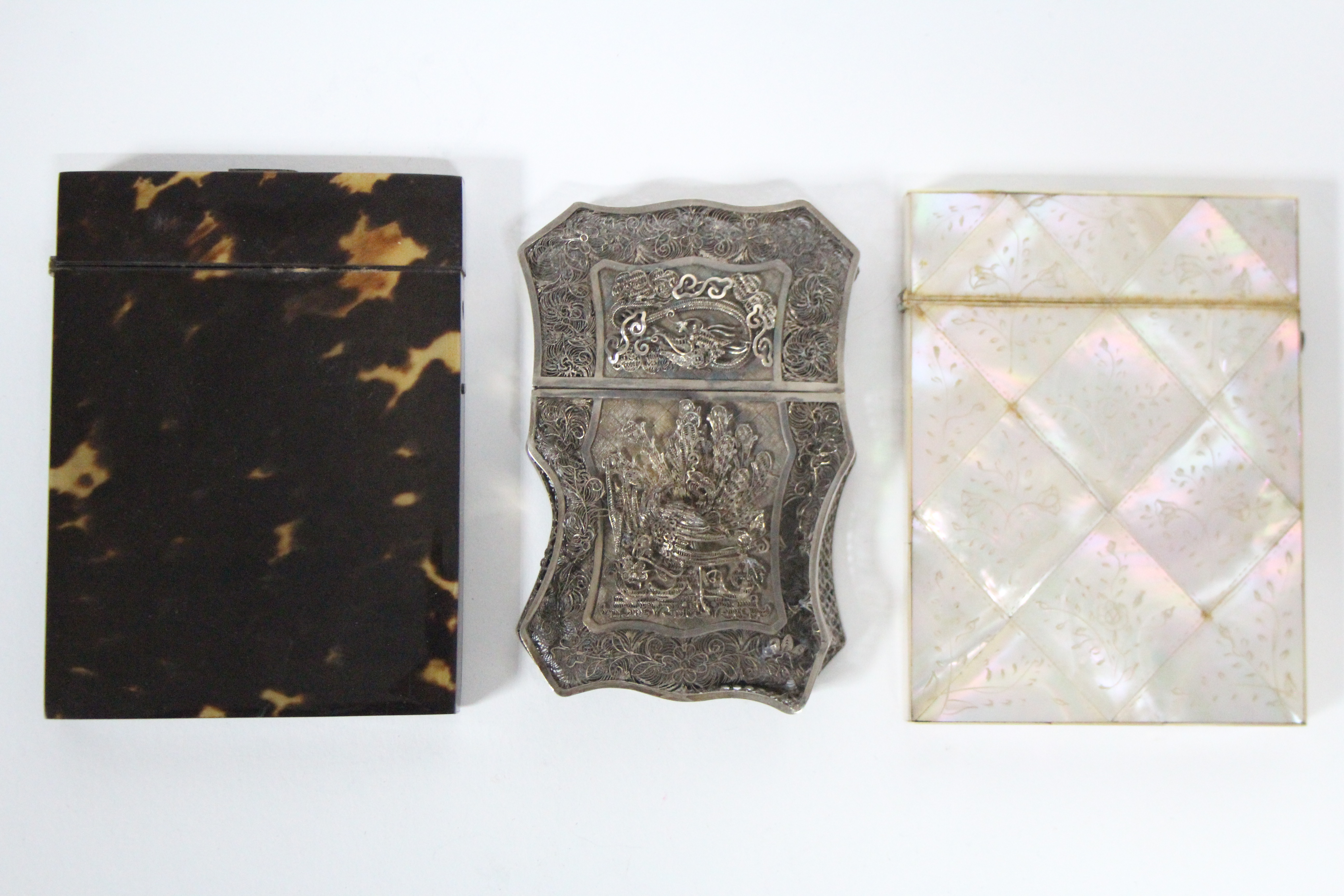 A 19th century engraved mother-of-pearl flat rectangular card case; a tortoiseshell ditto; & a