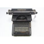 A vintage Smith Premier “No. 10” typewriter, with cover.