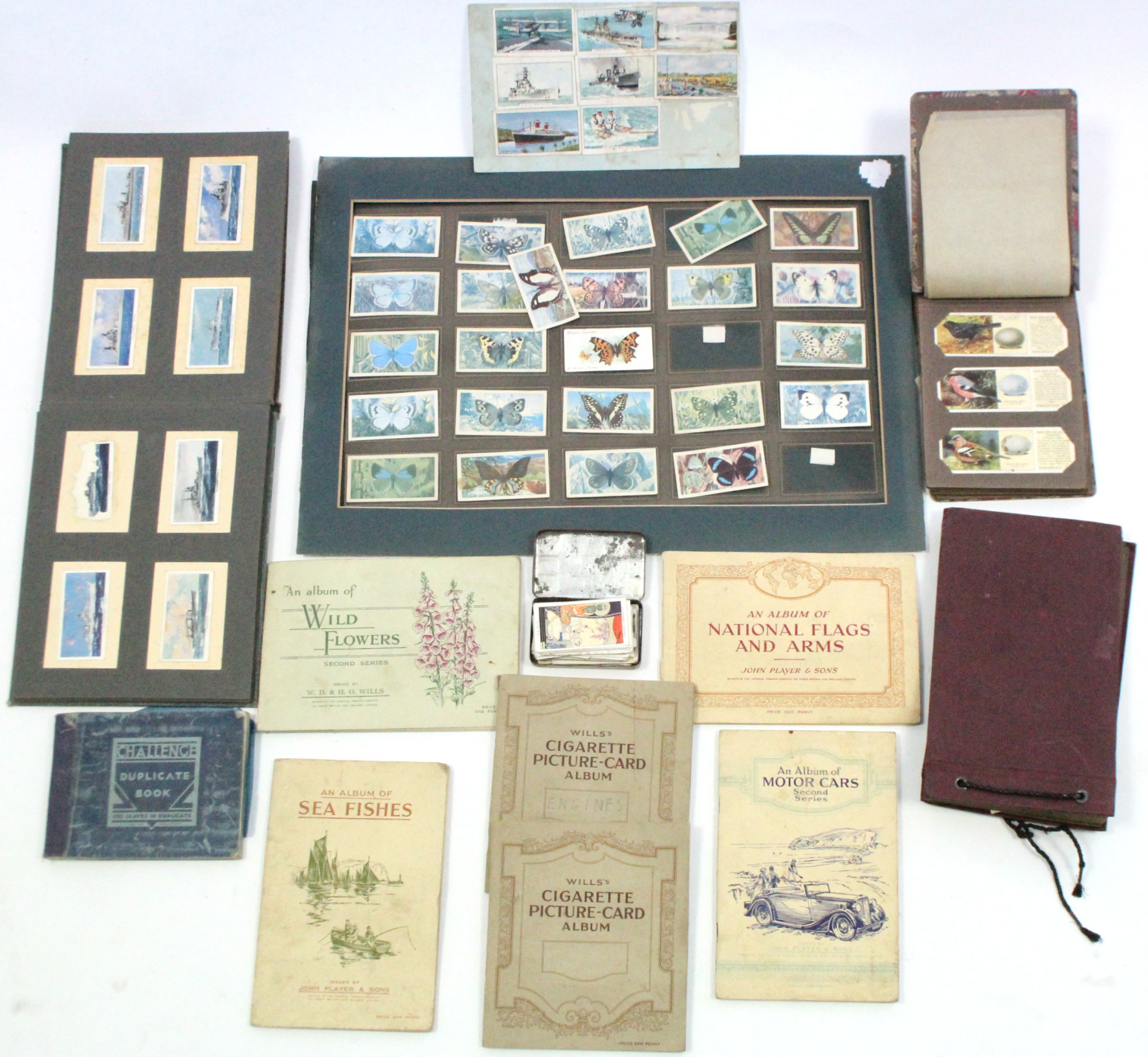 A collection of assorted cigarette cards contained in nine albums & loose.