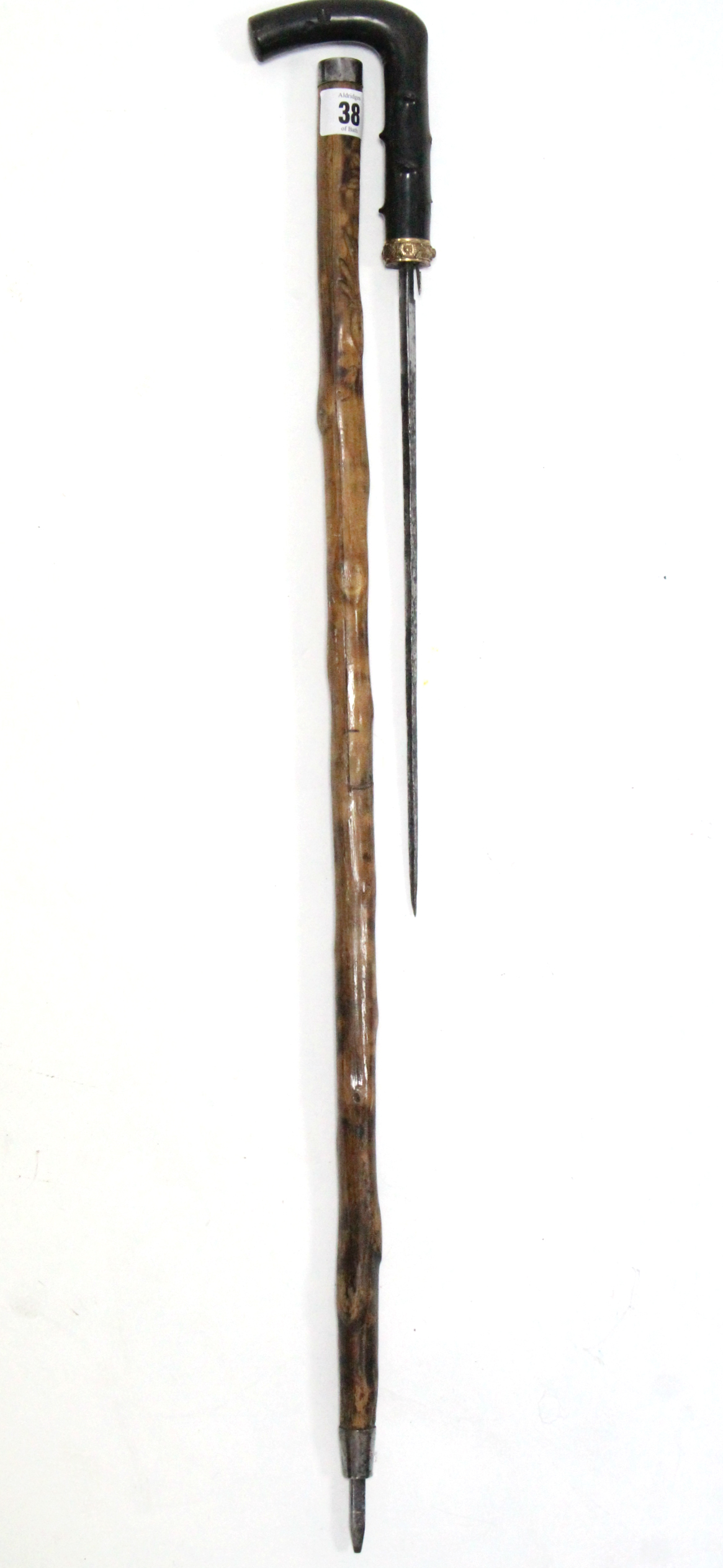 A late 19th/early 20th century swordstick with 12¼” long blade, carved bamboo shaft & yellow-metal