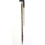 A late 19th/early 20th century swordstick with 12¼” long blade, carved bamboo shaft & yellow-metal