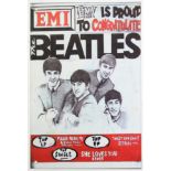 A reproduction aluminium rectangular sign “EMI IS PROUD TO CONGRATULATE THE BEATLES”, 11¾” x 7¾”.