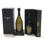 Two bottles of Moet et Chandon “Dom Perignon” champagne (1998 & 1999, 750ml), both boxed.