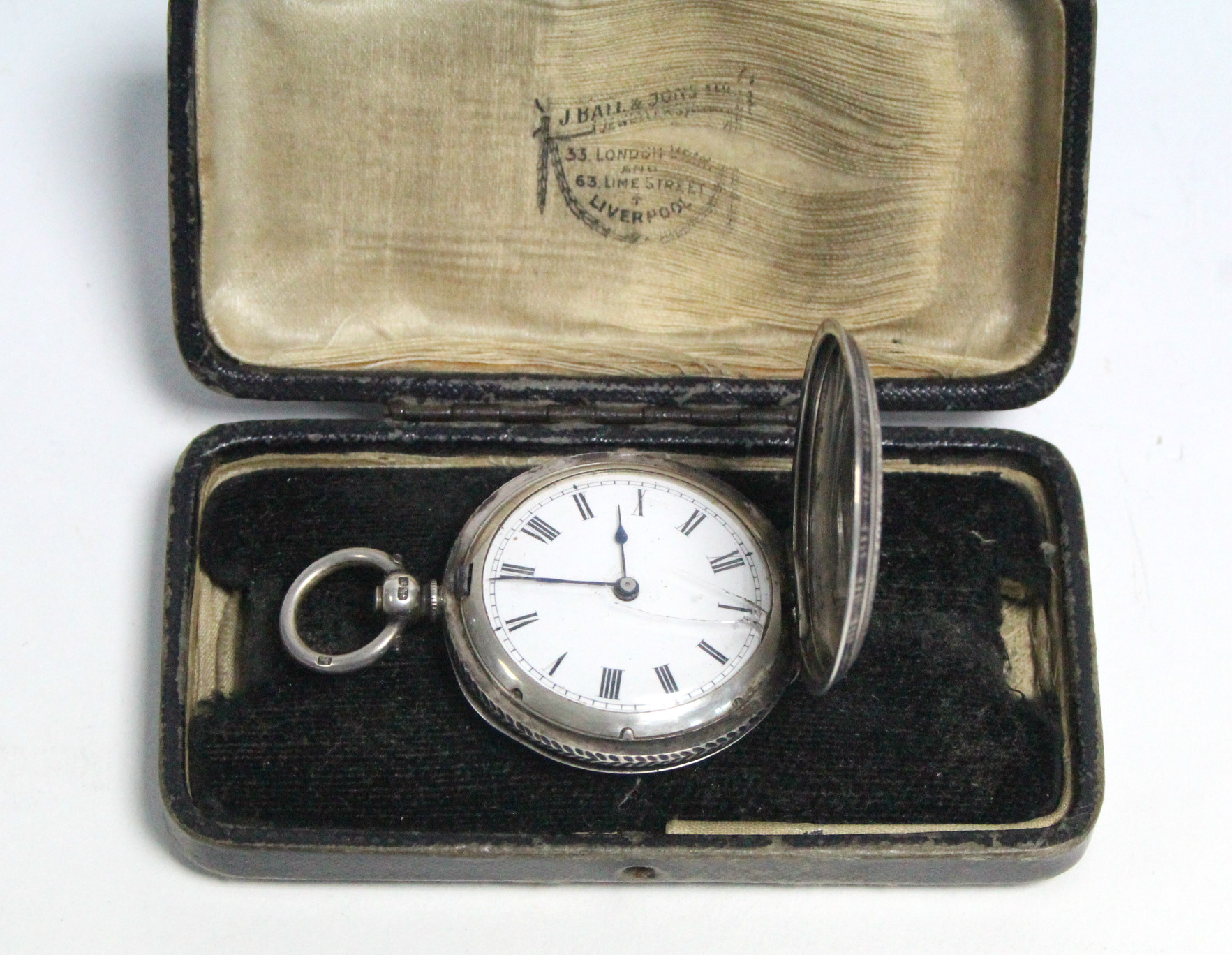 A late Victorian ladies’ fob watch in silver engraved case; together with two pocket watches; a