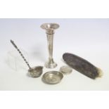 A silver backed clothes brush; a silver sifter spoon; a silver spill vase; & two other silver