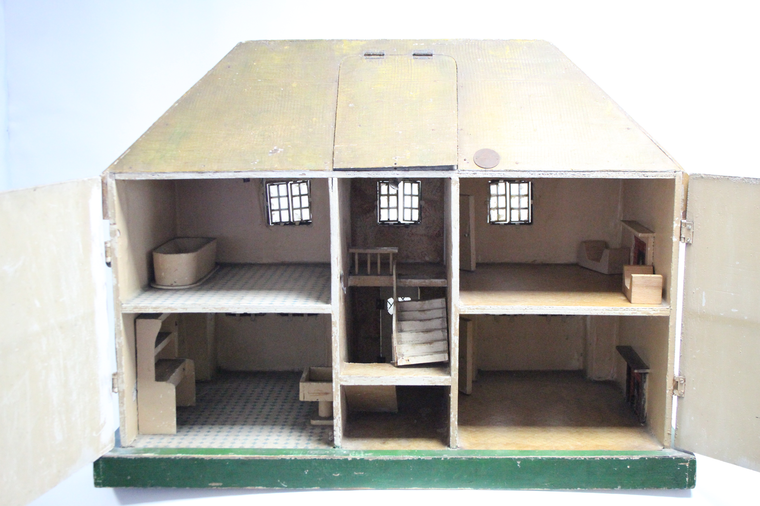 An early-mid 20th century Tri-ang painted wooden cottage-style two-storey doll’s house, with opening - Image 4 of 5