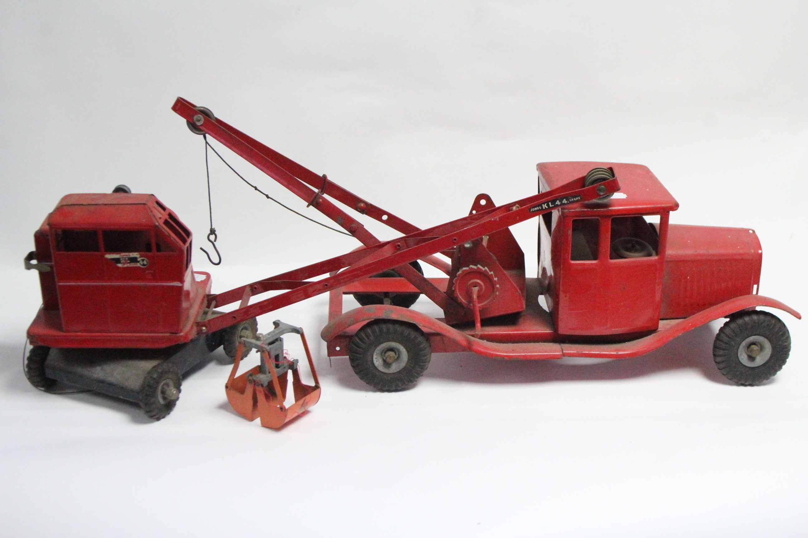 A Tri-ang tinplate toy pickup truck; & a ditto toy crane.