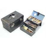 A late 19th/early 20th century japanned-metal cantilever-type artist’s paint box, 9½” wide, with