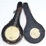 A banjo, 21¾” long, in black fibre-covered case.