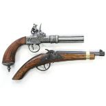 Two replica flintlock pistols.