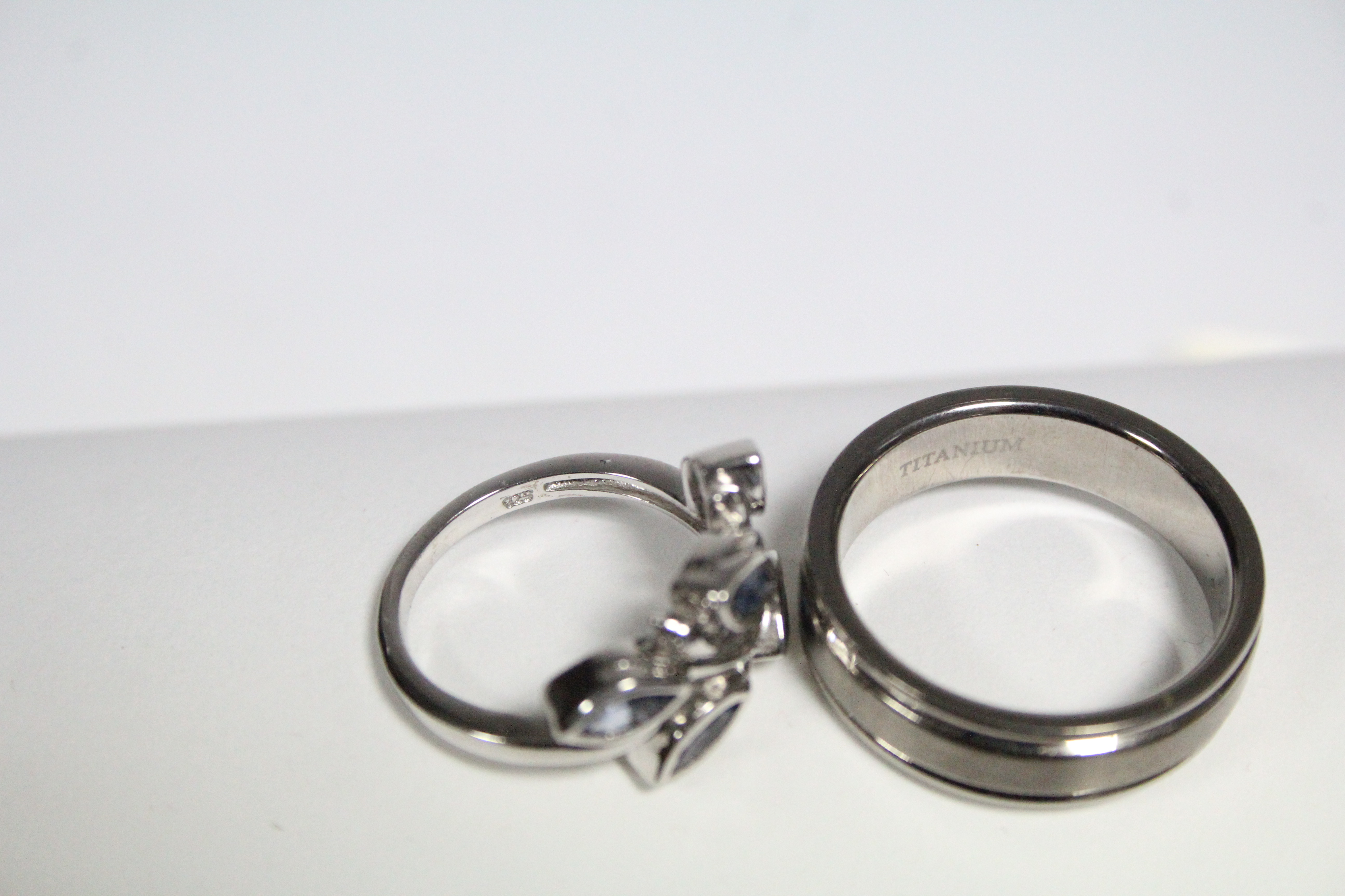 A titanium scarf ring; & a silver ring set spray of pale blue stones. - Image 2 of 2