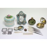 A silver & blue enamelled compact; a silver & pink enamelled pill box; four sewing implements,