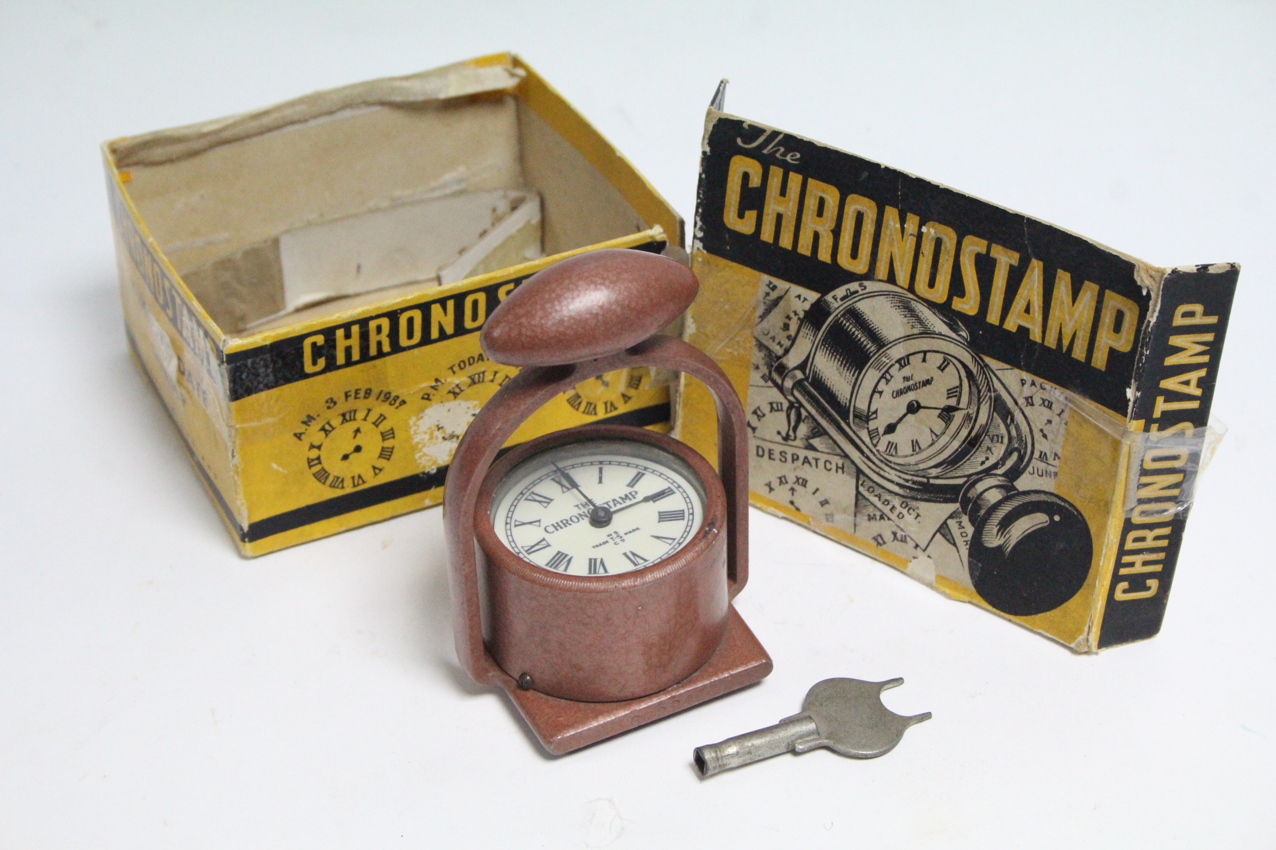 A mid-20th century Warwicks Time Stamp Co. of London “Chronostamp” time & date stamp, boxed.