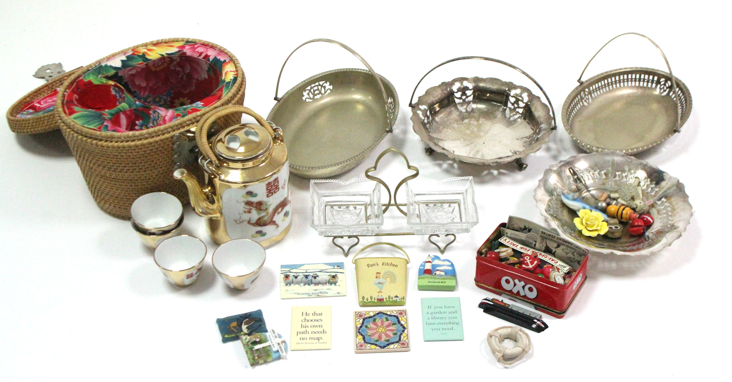 A Chinese porcelain dragon decorated teapot & four matching teabowls in wicker case; together with