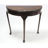 A mahogany demi-lune hall table on three slender cabriole legs & pad feet, 32½” wide (w.a.f.)
