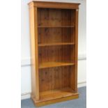 A pine tall standing open bookcase with six adjustable shelves, & on plinth base, 38” wide x 77¾”