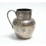 A late Victorian silver globular cream jug, 3" high, London 1897.