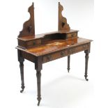 A late Victorian mahogany dressing table (lacking mirror) fitted two frieze drawers, & on ring-