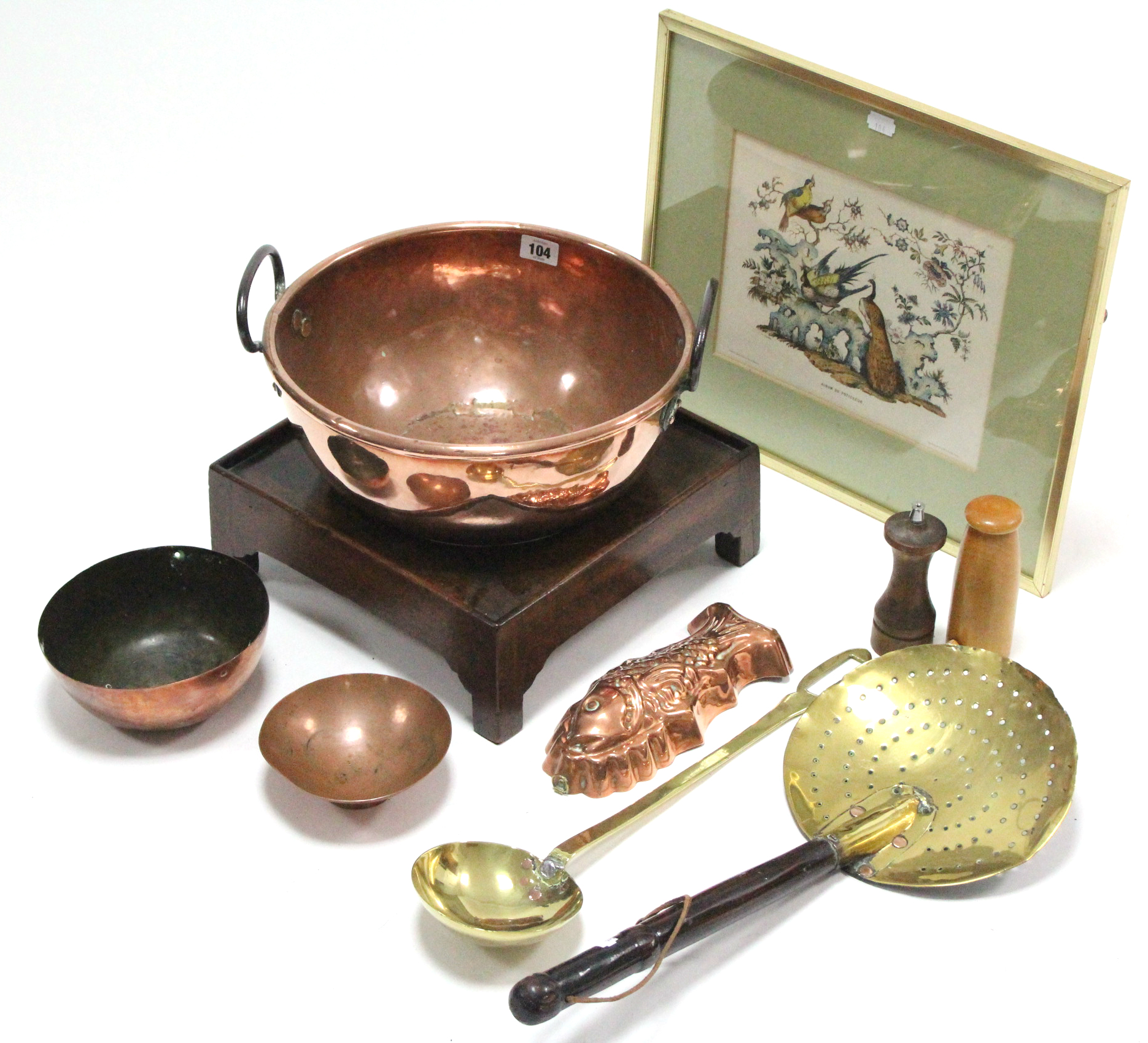 A copper circular two-handled dish, 12¼” diameter, on hardwood stand; a brass skillet; various other