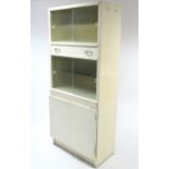 A mid-20th century white painted wooden tall kitchen cabinet, 30" wide x 70" high.