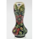 A modern Moorcroft pottery floral decorated vase, 11½” high.