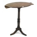 A 19th century mahogany tripod table with oval top, & on vase-turned centre column & three splay