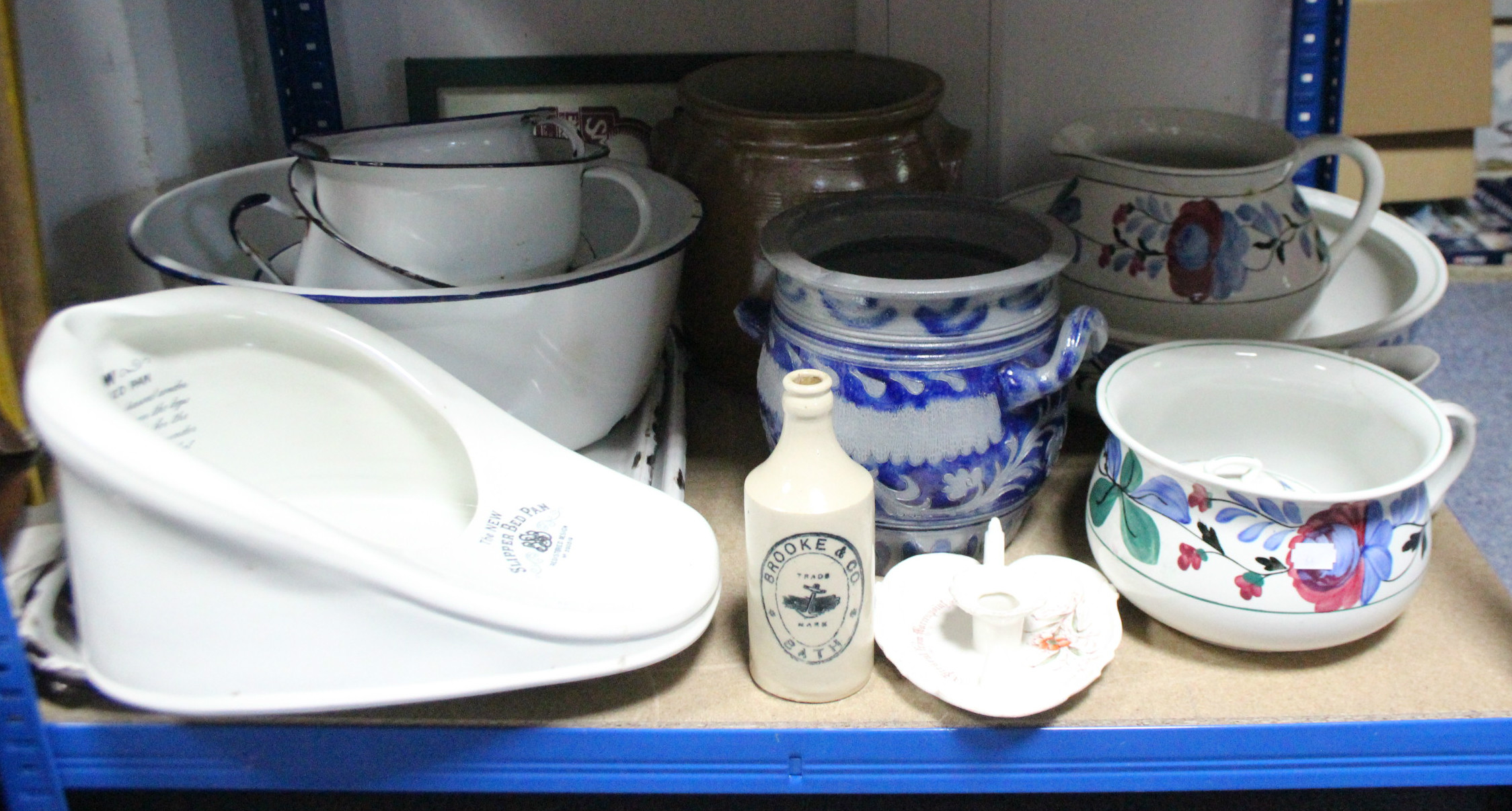 A floral decorated five-piece toilet set; two stoneware foot warmers; three tankards, etc.