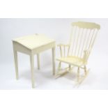 A white painted spindle-back rocking chair; & a white painted child's desk.