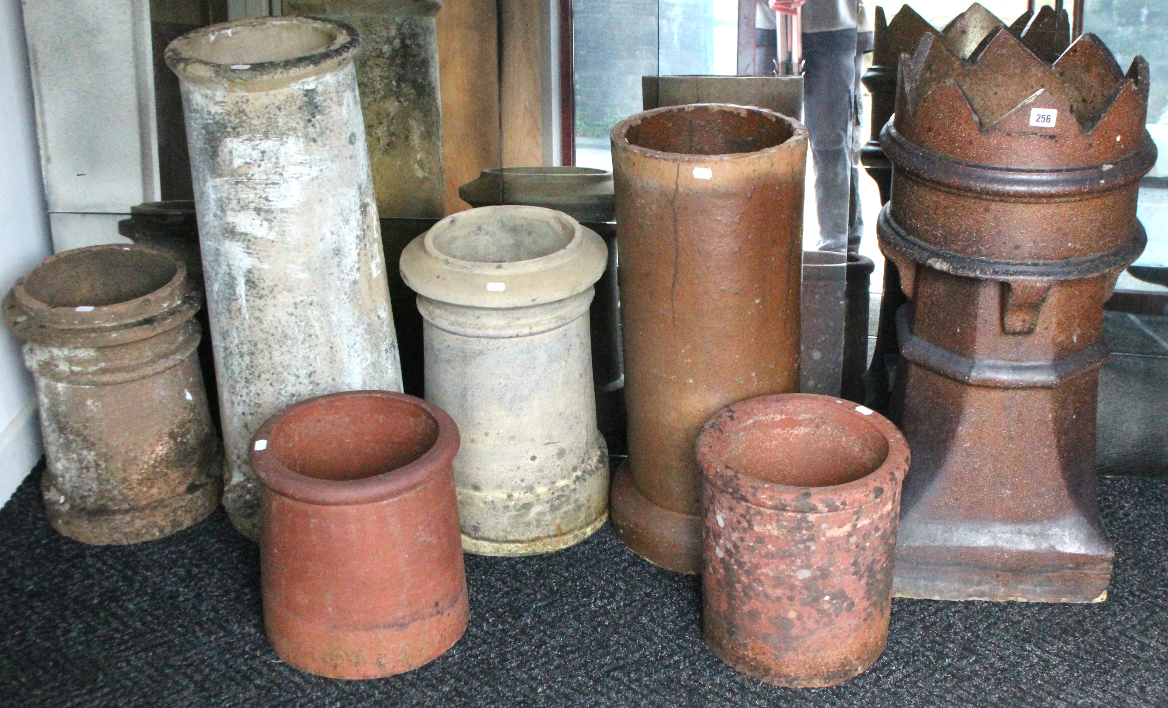 Seven various chimney pots (various sizes).