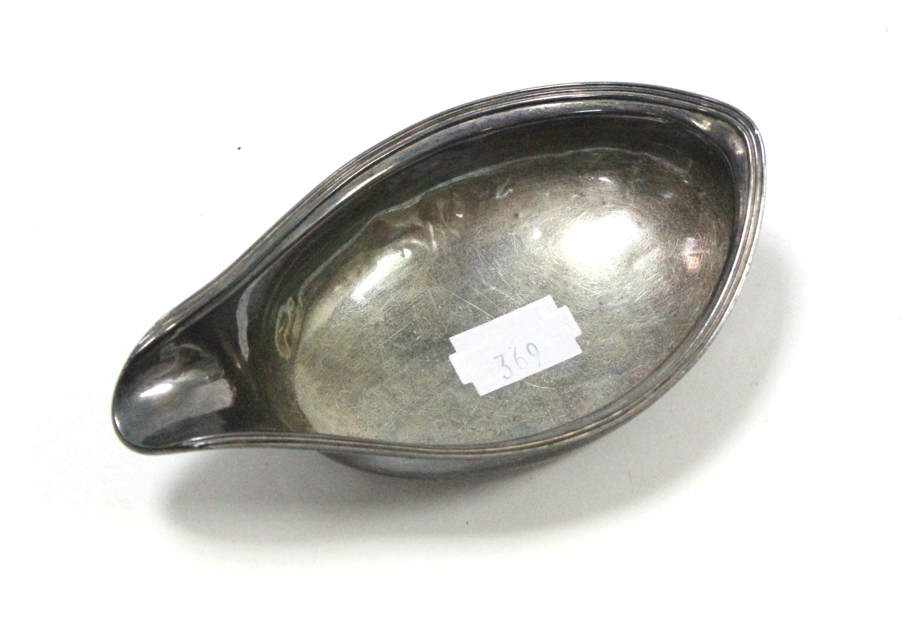 A George III silver pap bowl, 5” long, London 1812.