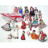 Approximately thirty various dolls.