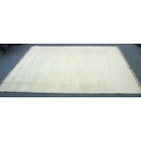 A Kayam wool carpet of ivory ground, 9’2” x 12’; & a modern rug.