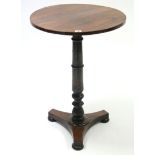 An early Victorian rosewood pedestal table with circular top, on turned & carved centre column &