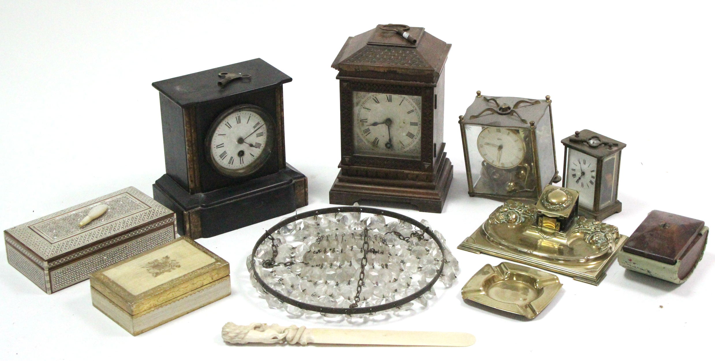 A 19th century mantel clock in black slate case; together with two other mantel clocks; a brass