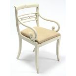 A regency-style white painted wood bow-back carver chair, with scroll arms, padded drop-in-seat, &