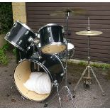 A Stagg drum kit, black finish, comprising: a 22” kick drum, a 12” tom, a 13” tom, a 16” side tom, a