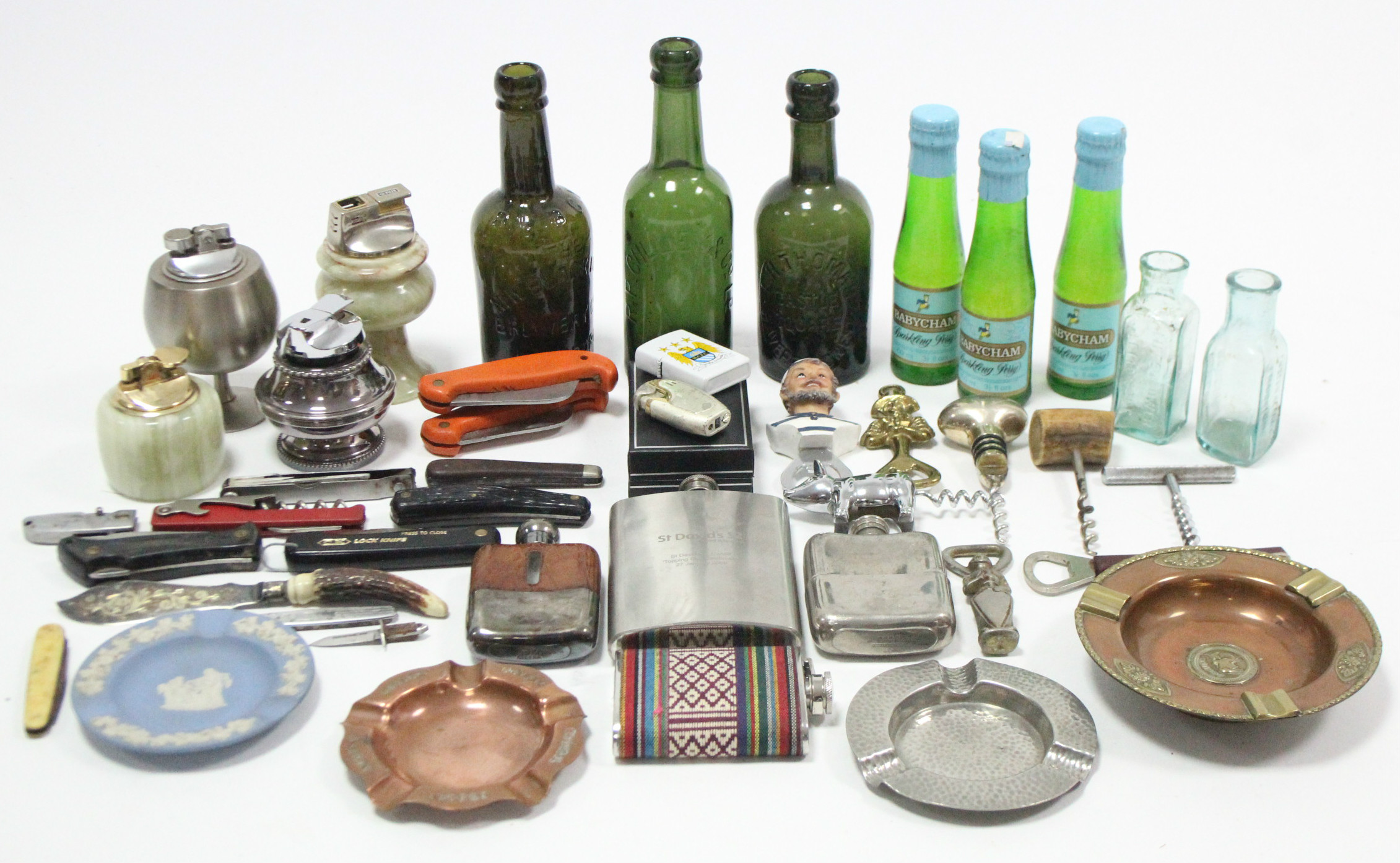 A collection of assorted corkscrews; penknives; cigarette lighters; ashtrays; & hipflasks; three