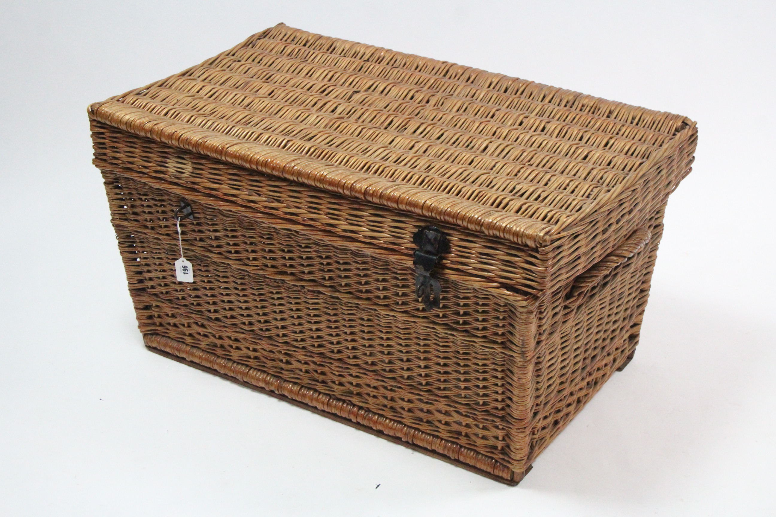 A large wicker hamper (lacking contents), 36” wide.