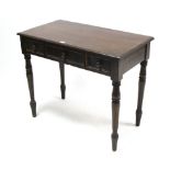 A 19th century mahogany side table fitted two frieze drawers, & on turned tapered legs, 34¾” wide.