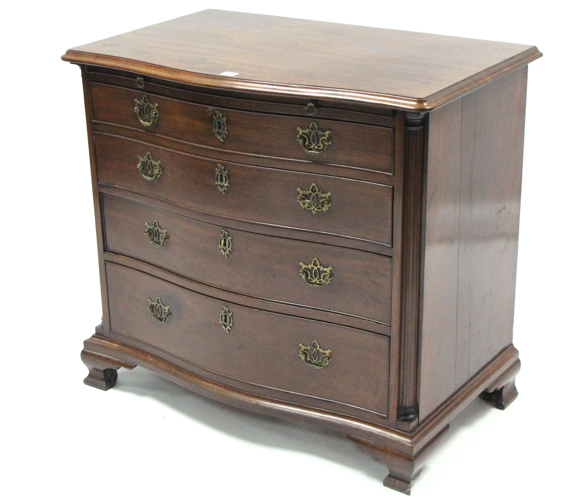 A Georgian-style mahogany serpentine-front chest, fitted four long graduated drawers with brass wing