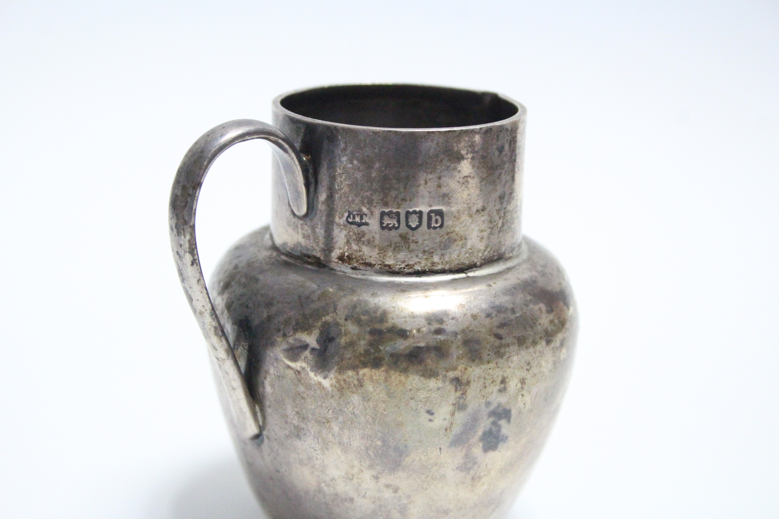 A late Victorian silver globular cream jug, 3" high, London 1897. - Image 2 of 4