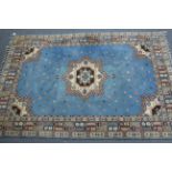 A Persian pattern small carpet of pale blue & ivory ground, with multi-coloured geometric design