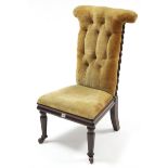 A Victorian mahogany prie-dieu chair upholstered gold velour, & on octagonal tapered legs with