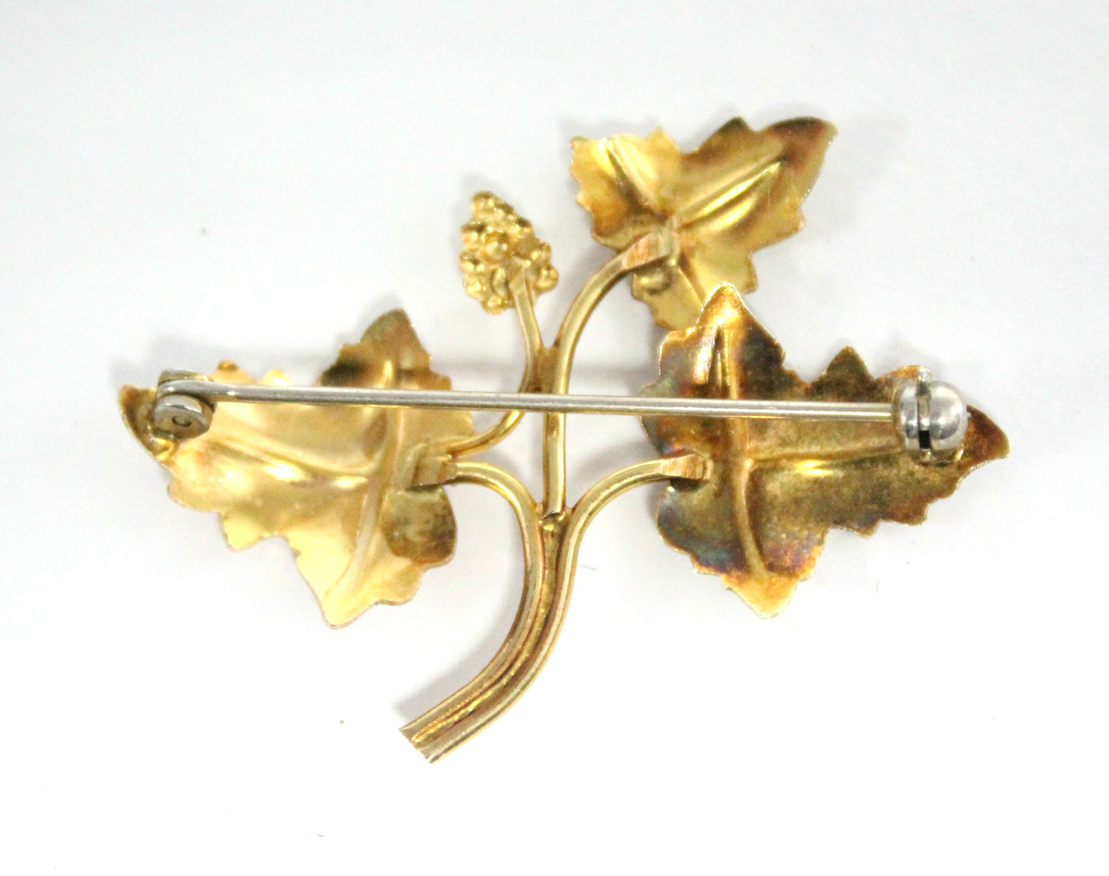 An un-marked three-colour metal leaf spray brooch. - Image 2 of 2