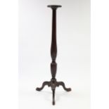 A 19th century mahogany torchère on slender fluted & carved centre column & cabriole legs with pad