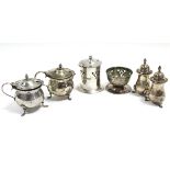 A Guild of Handicrafts pierced cylindrical mustard pot & matching circular salt cellar, each with