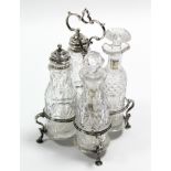 An early Victorian cruet stand with centre ring handle & on four pad feet, “ high, fitted four cut