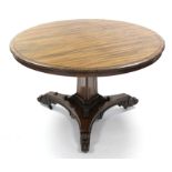 A mid-Victorian rosewood centre table, the circular tilt-top with moulded edge, on triangular centre