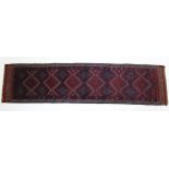 A Meshwari runner of blue, red & ivory ground with all-over repeating geometric lozenge design;